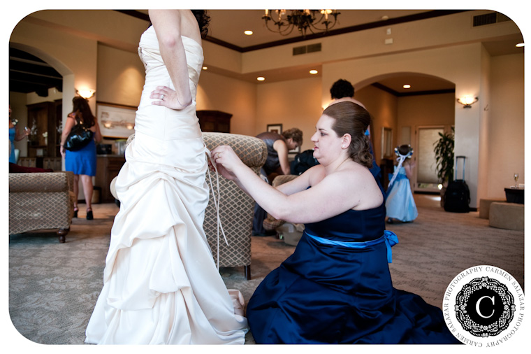 bridal gown getting laced up