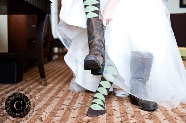 Bride getting on her unique wedding boots at La Provence