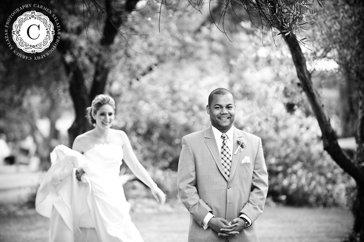 Happy groom in a grey suit