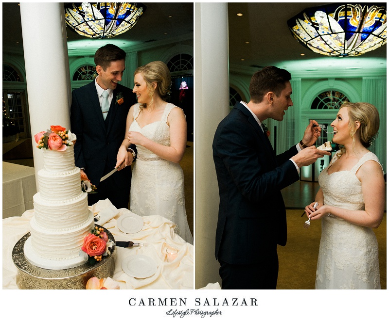 the bride and groom cut the cake and take a bite
