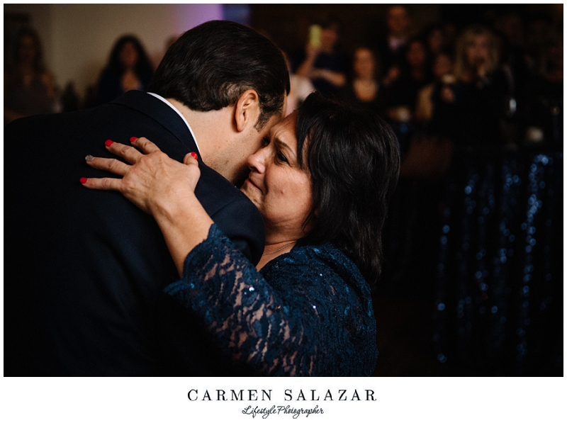 groom embraces his mother at a Sutter Club reception groom embraces his mother at a Sutter Club reception