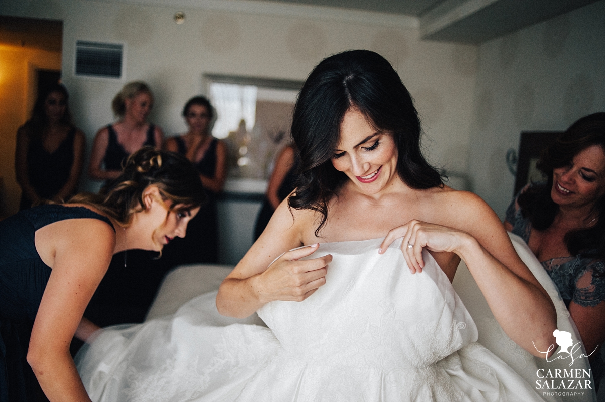 Bride putting on gown at Fairmont - Carmen Salazar Bride putting on gown at Fairmont - Carmen Salazar