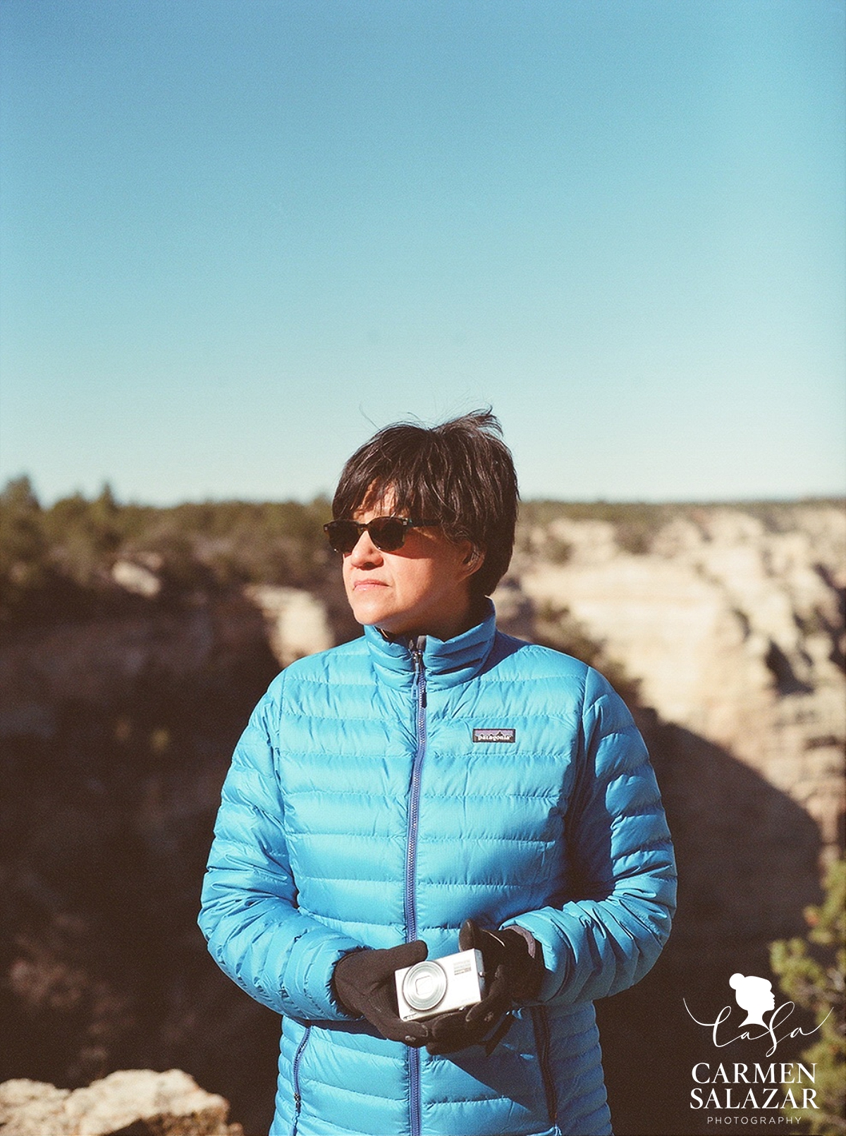 portrait of woman at grand canyon with camera by Carmen Salazar portrait of woman at grand canyon with camera by Carmen Salazar
