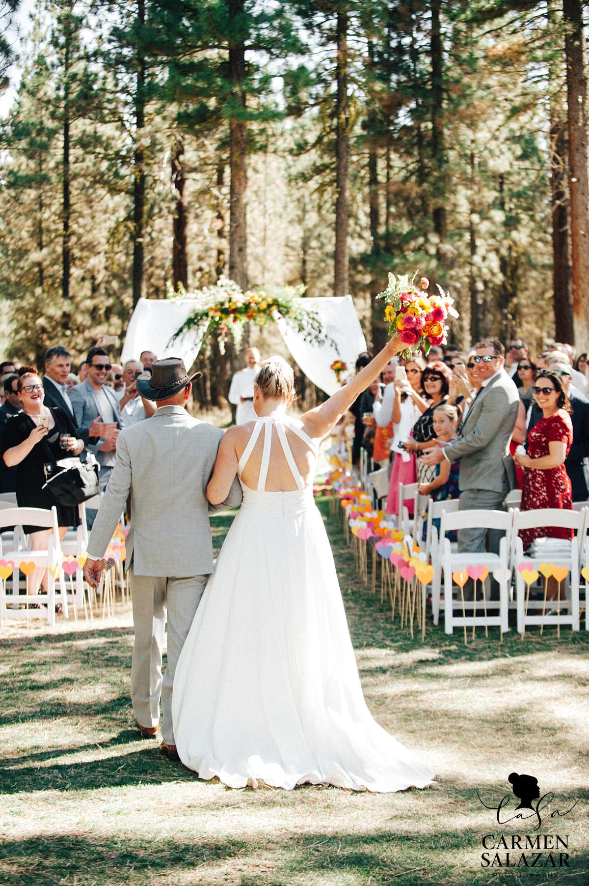 Excited bride walking down the aisle at Chalet View Lodge wedding - Carmen Salazar Excited bride walking down the aisle at Chalet View Lodge wedding - Carmen Salazar