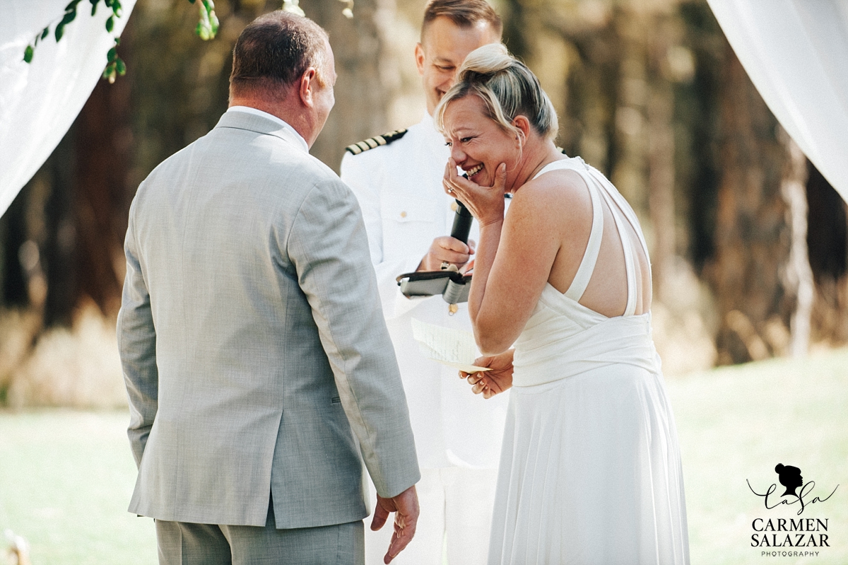 Laughing bride at outdoor ceremony - Carmen Salazar Laughing bride at outdoor ceremony - Carmen Salazar