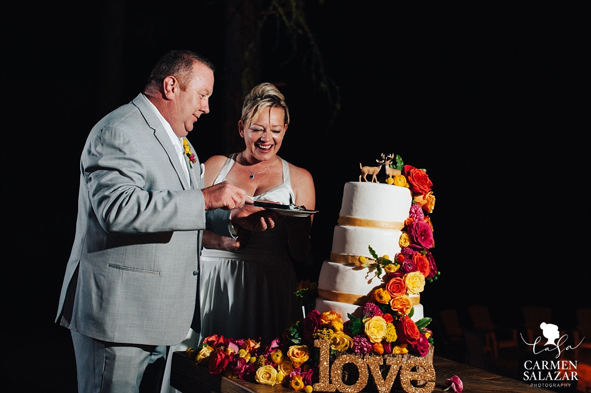 Bride and groom cutting fun cake at Chalet View Lodge- Carmen Salazar Bride and groom cutting fun cake at Chalet View Lodge- Carmen Salazar