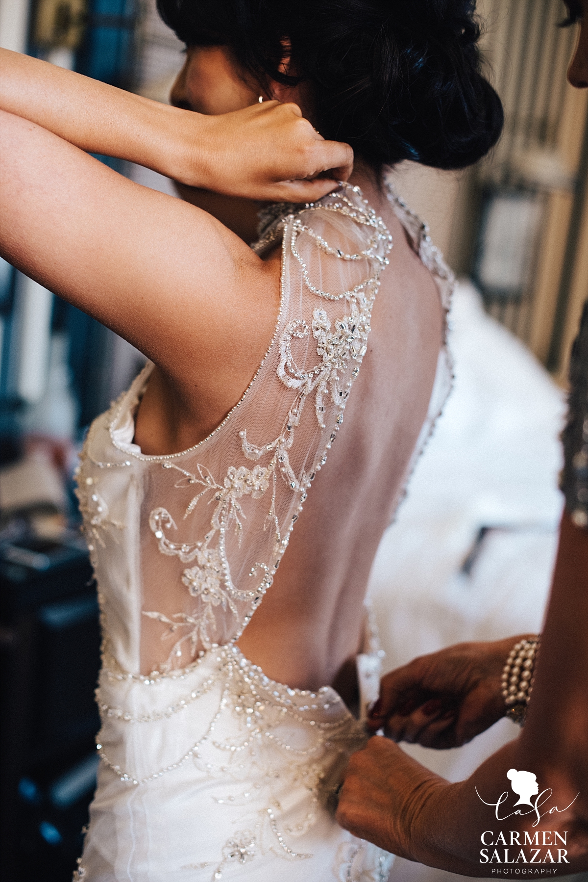 Bride zipping up dress at The Citizen Hotel - Carmen Salazar Bride zipping up dress at The Citizen Hotel - Carmen Salazar