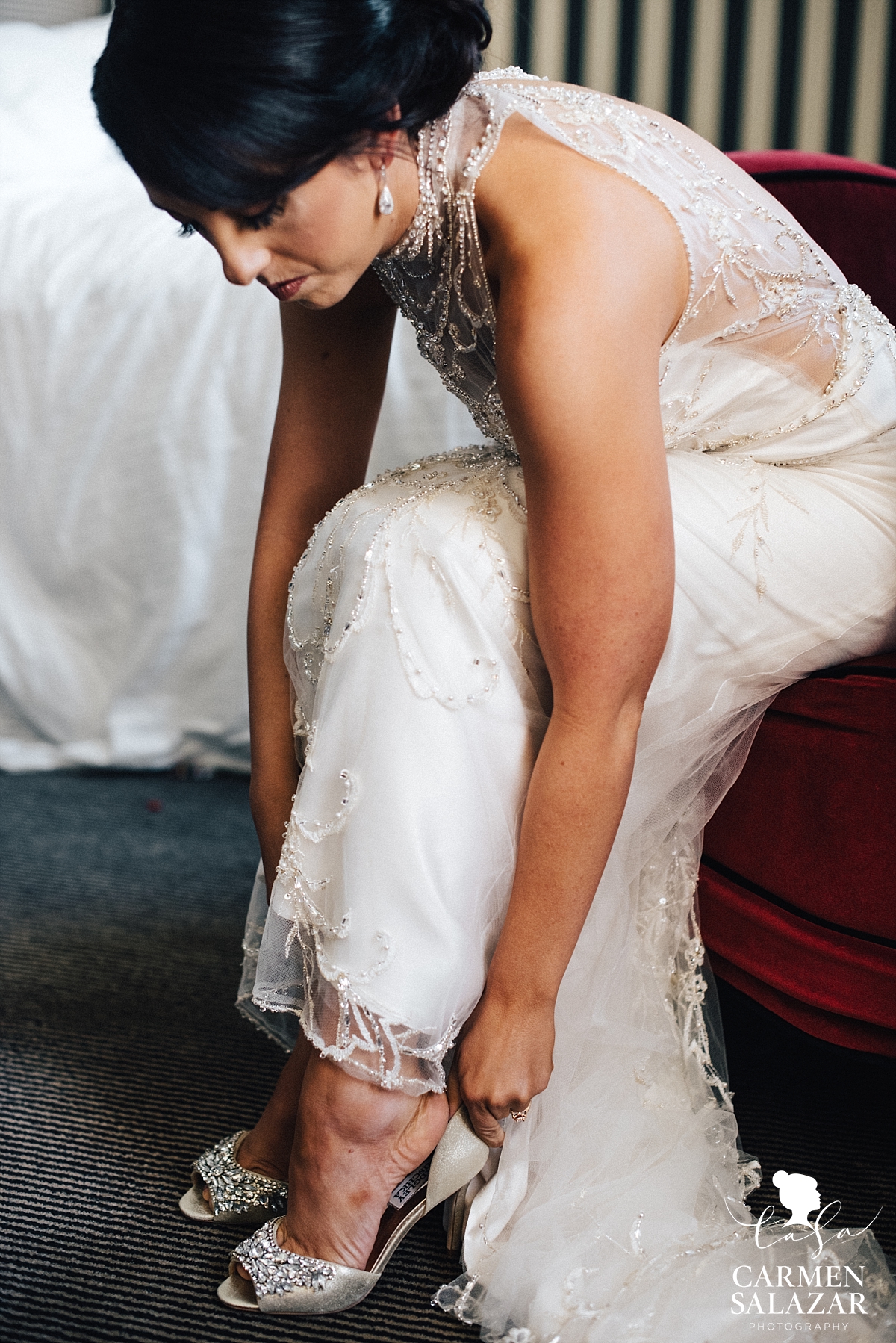Bride putting on shoes at The Citizen - Carmen Salazar Bride putting on shoes at The Citizen - Carmen Salazar