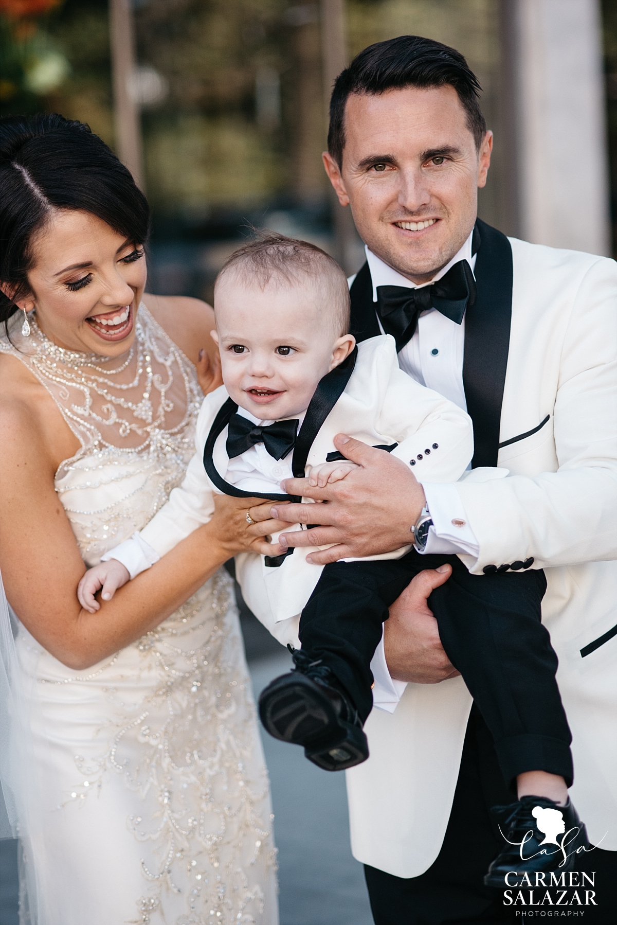 Bride and groom celebrating with baby before ceremony - Carmen Salazar Bride and groom celebrating with baby before ceremony - Carmen Salazar