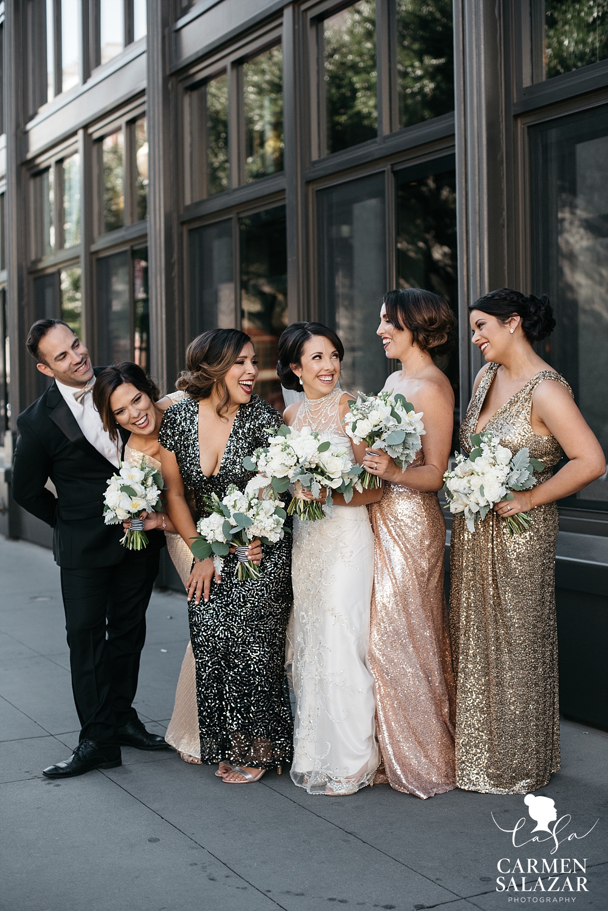 Playful bridal party photos in front of The Grange - Carmen Salazar Playful bridal party photos in front of The Grange - Carmen Salazar